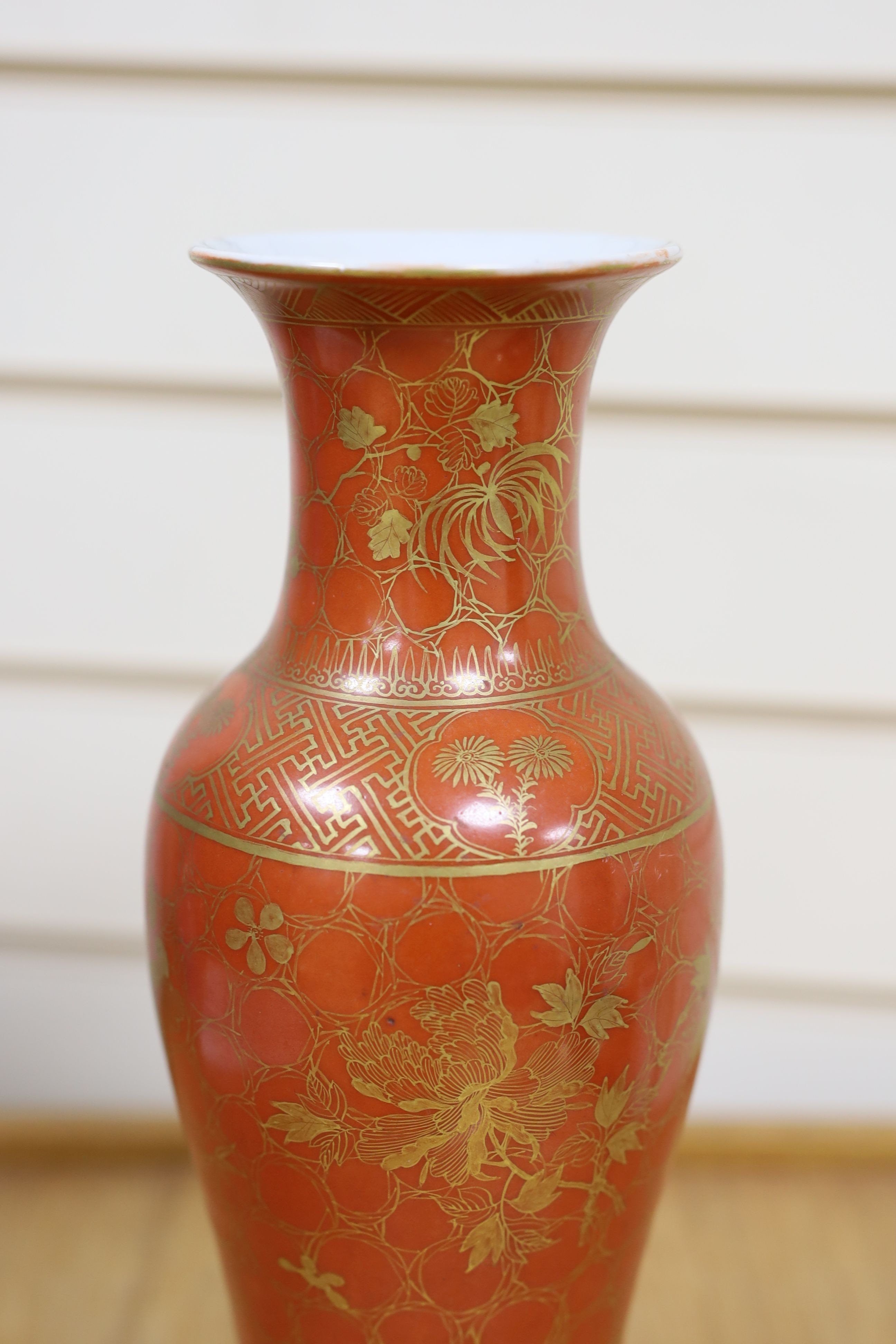 A Chinese blue and white gourd vase with landscape decoration, a similar blue and white sleeve vase and a Japanese Kutani vase